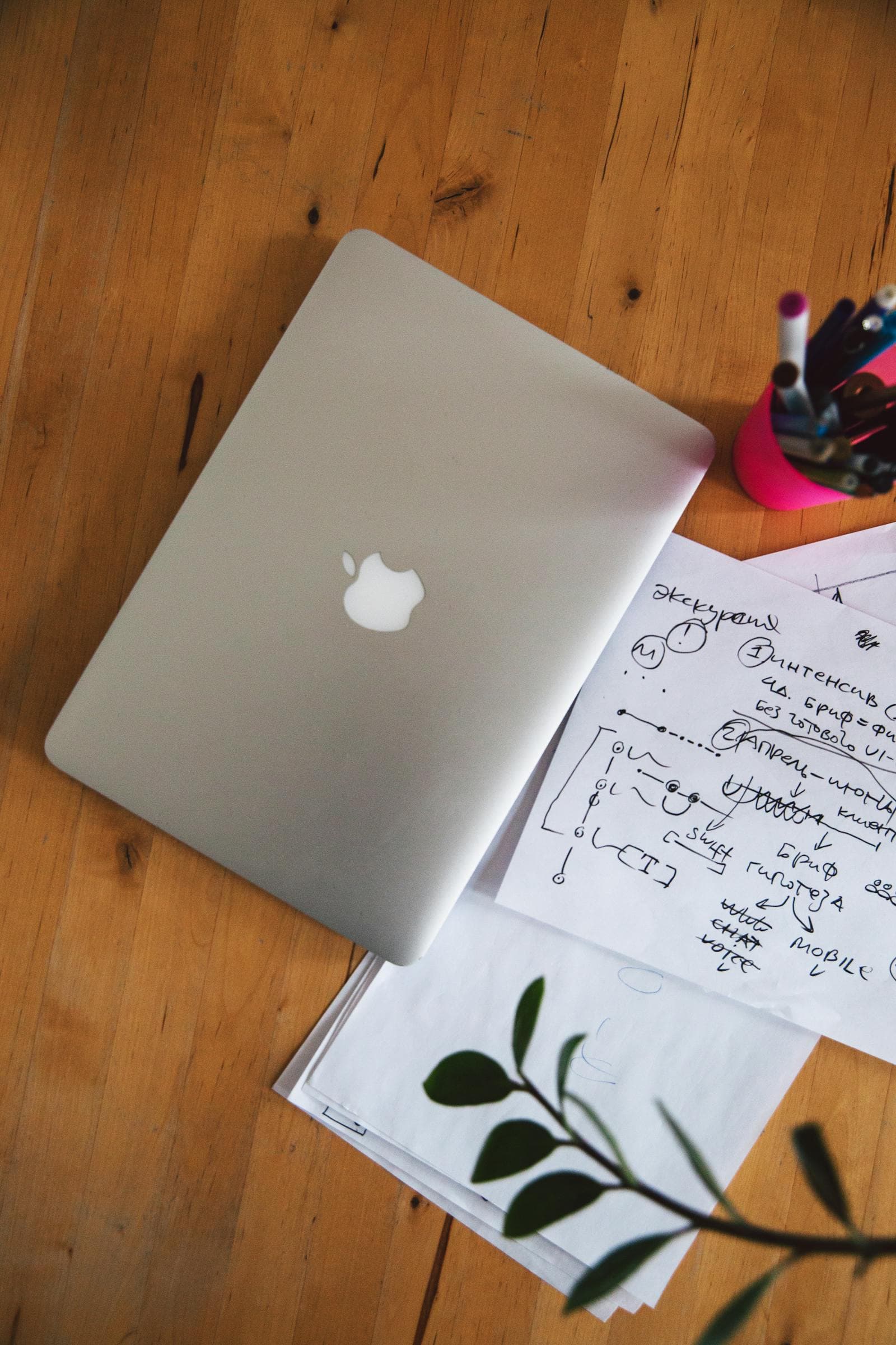 Focused laptop workspace with notebook for account recovery and LMS access